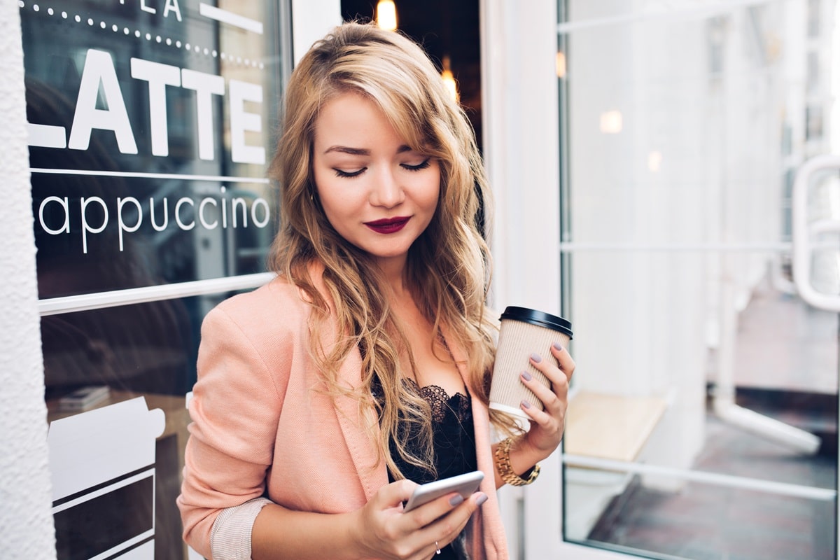 Woman reading an SMS on her phone