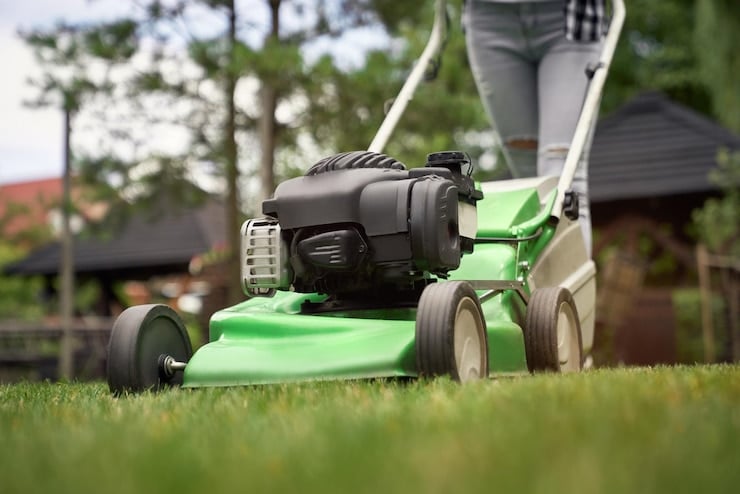 person using a lawn mower