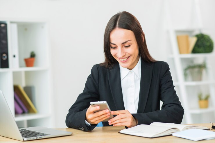 a businesswoman reading a text message