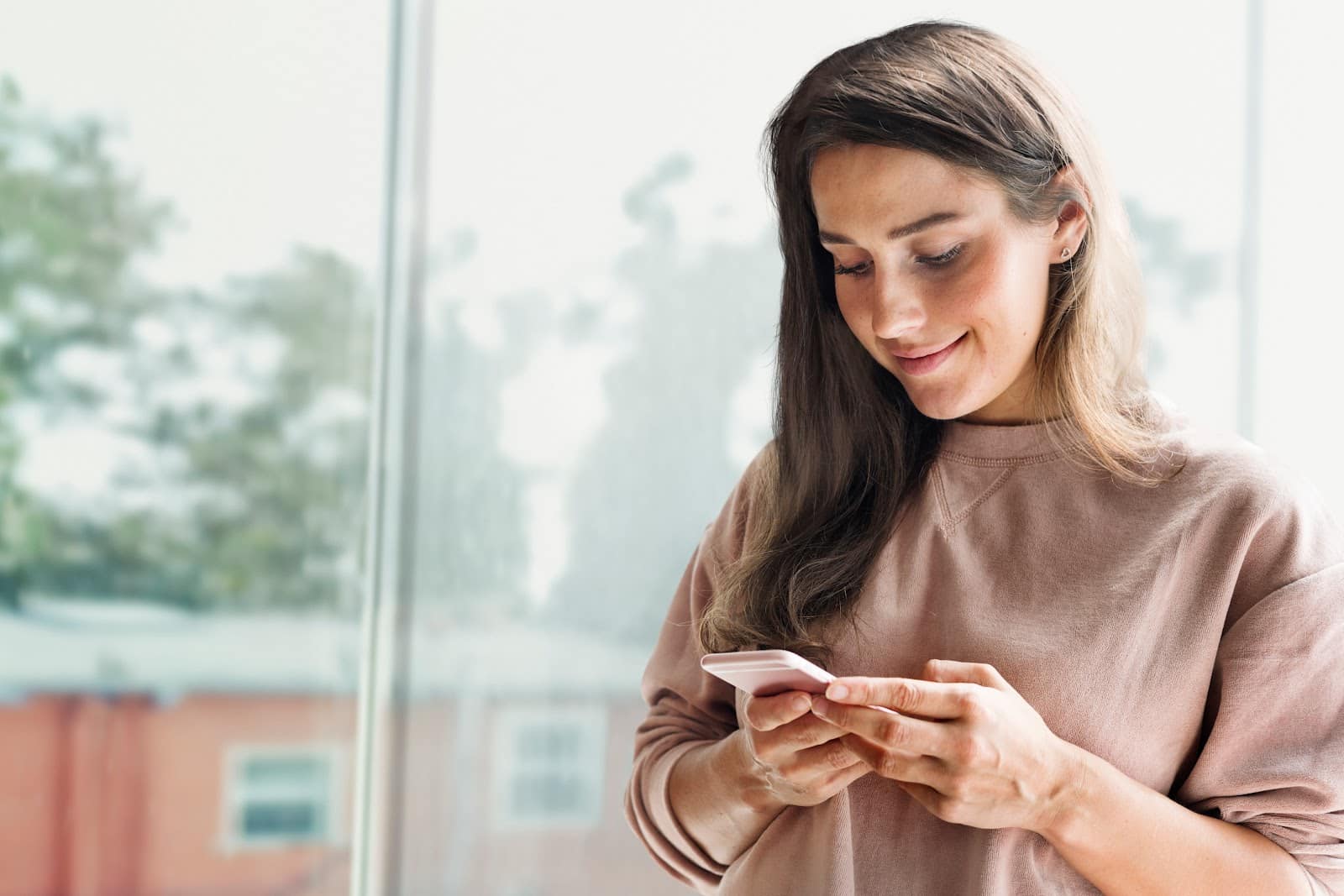 woman sending a text message