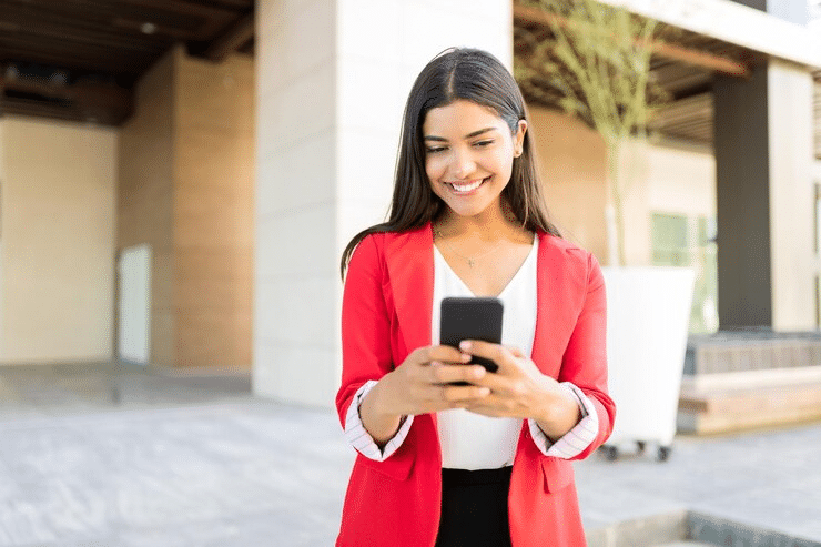 woman reading an sms and smiling