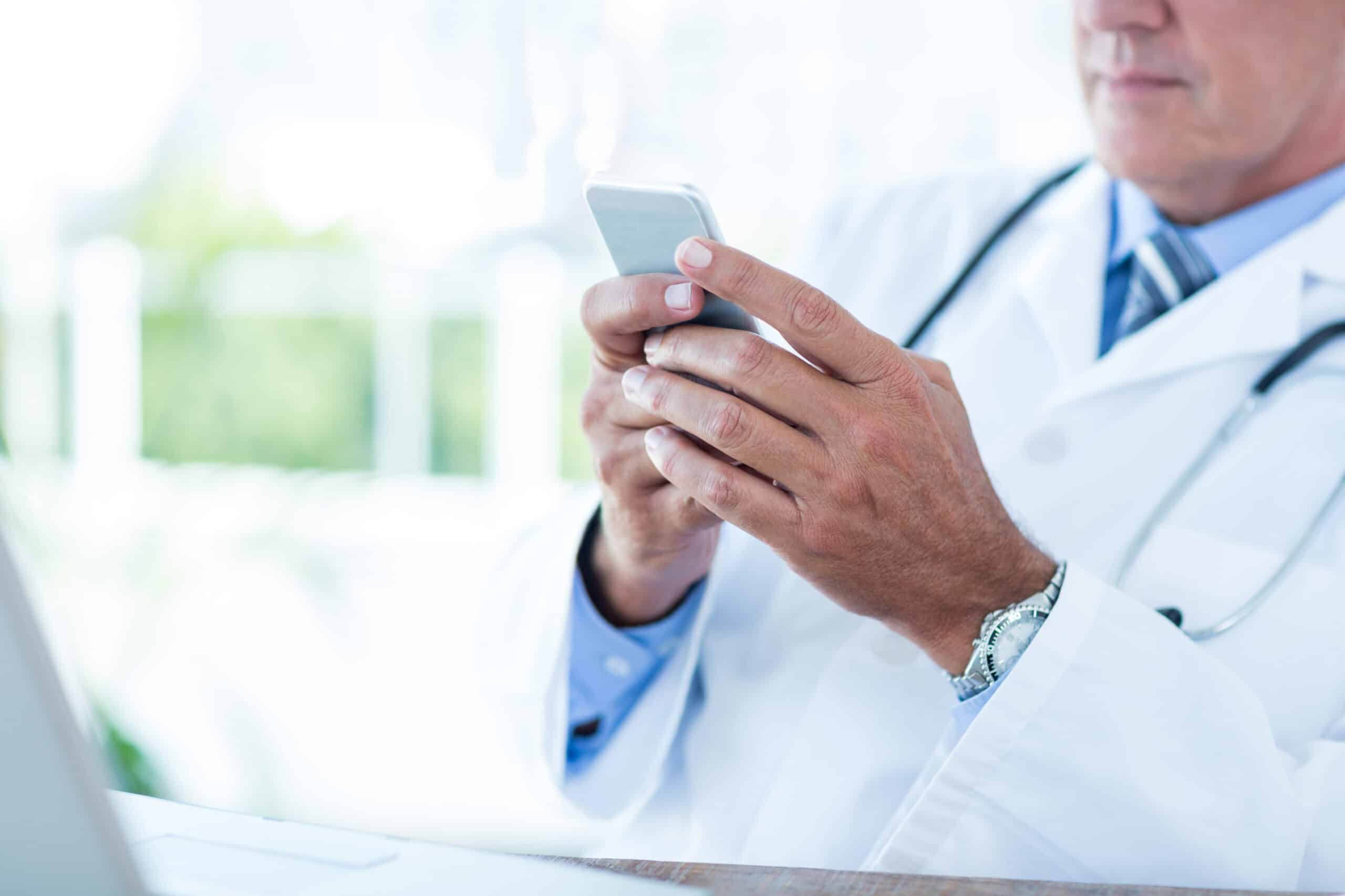 a doctor using a mobile phone