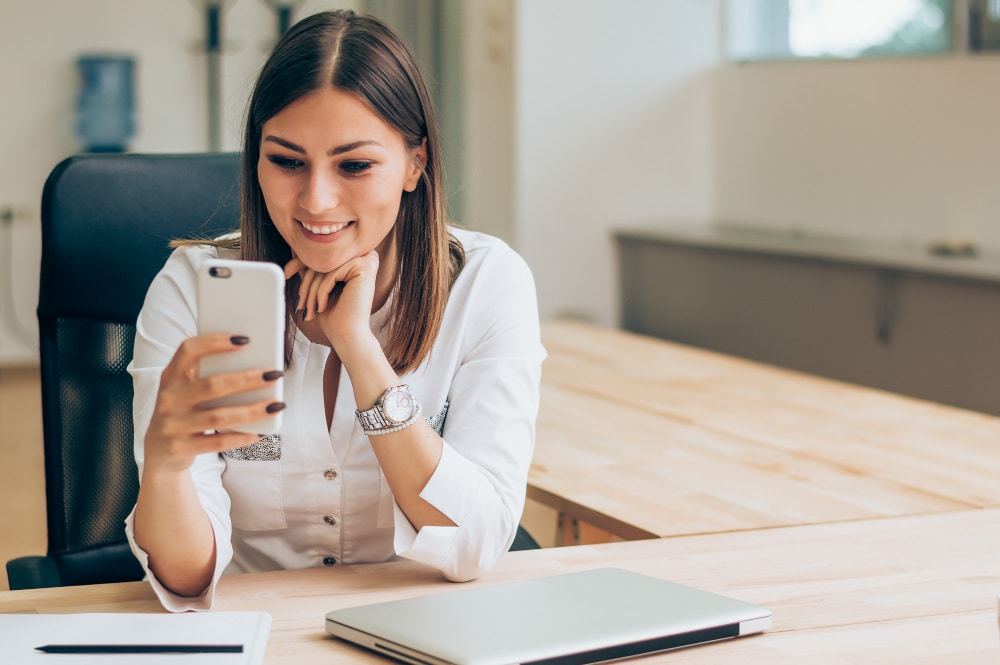 woman sending a text message