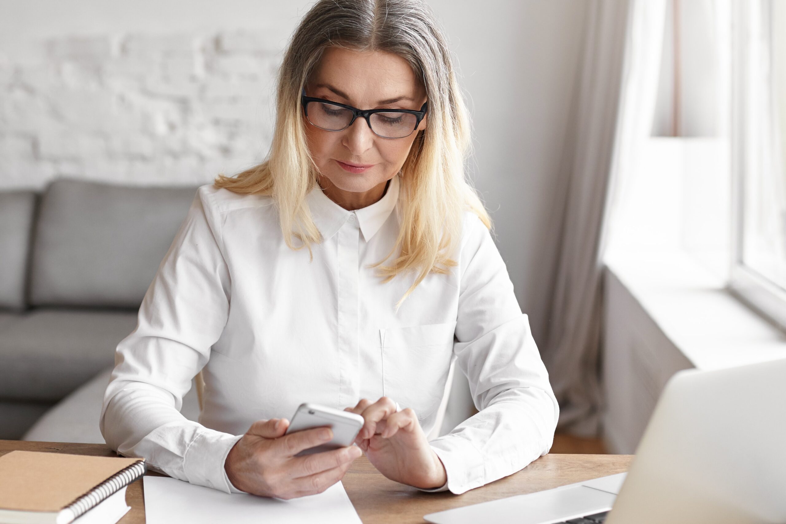 a woman holding her phone