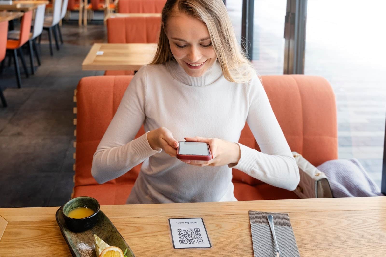 A girl scanning a QR Code